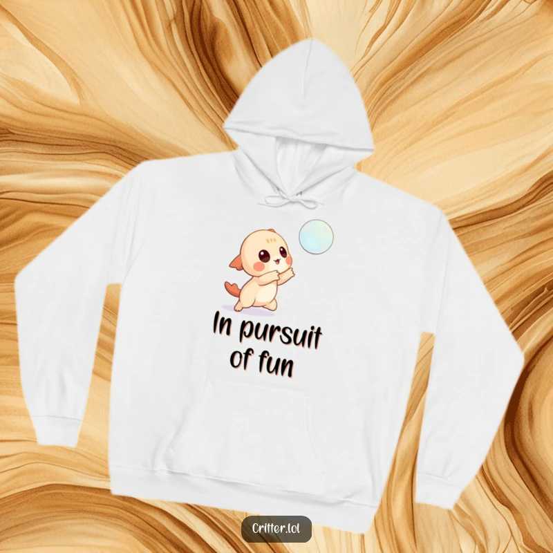 Funny hoodie showing a playful creature character reaching for a floating bubble, embodying carefree fun.
