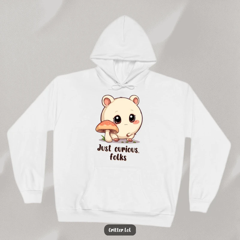 Funny hoodie featuring a round critter with big eyes sniffing a mushroom, offering warmth and a sense of woodland mystery.