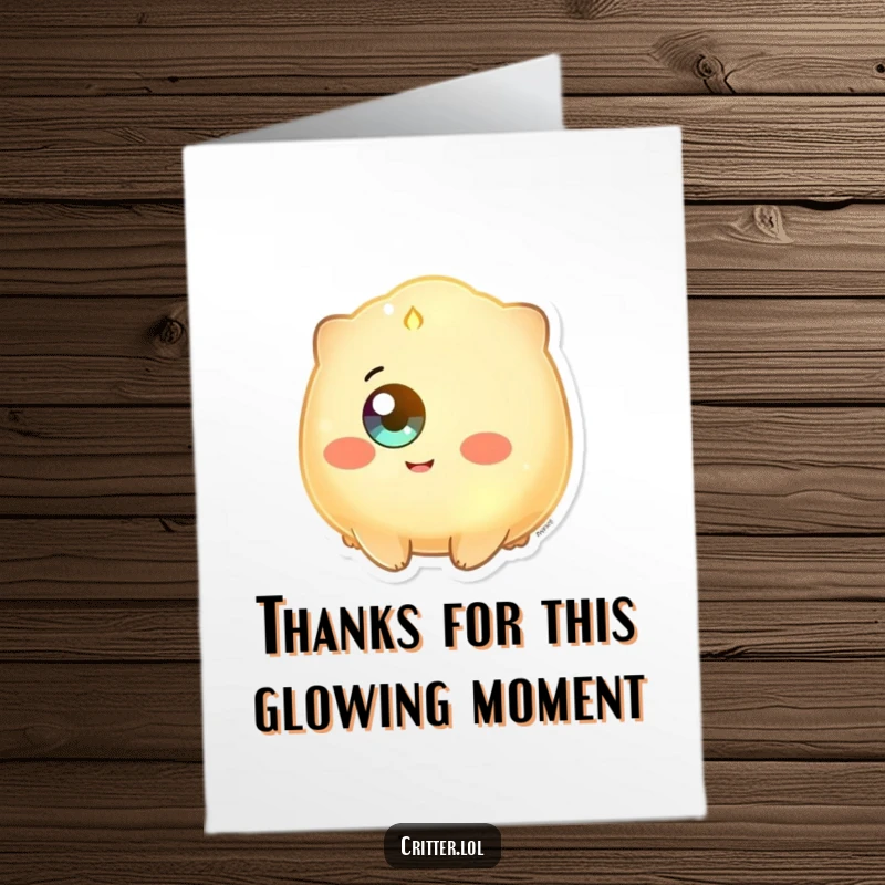 Funny Free Printable Thank You Card: A glowing creature with a single eye beaming with happiness, conveying warm and sincere gratitude.
