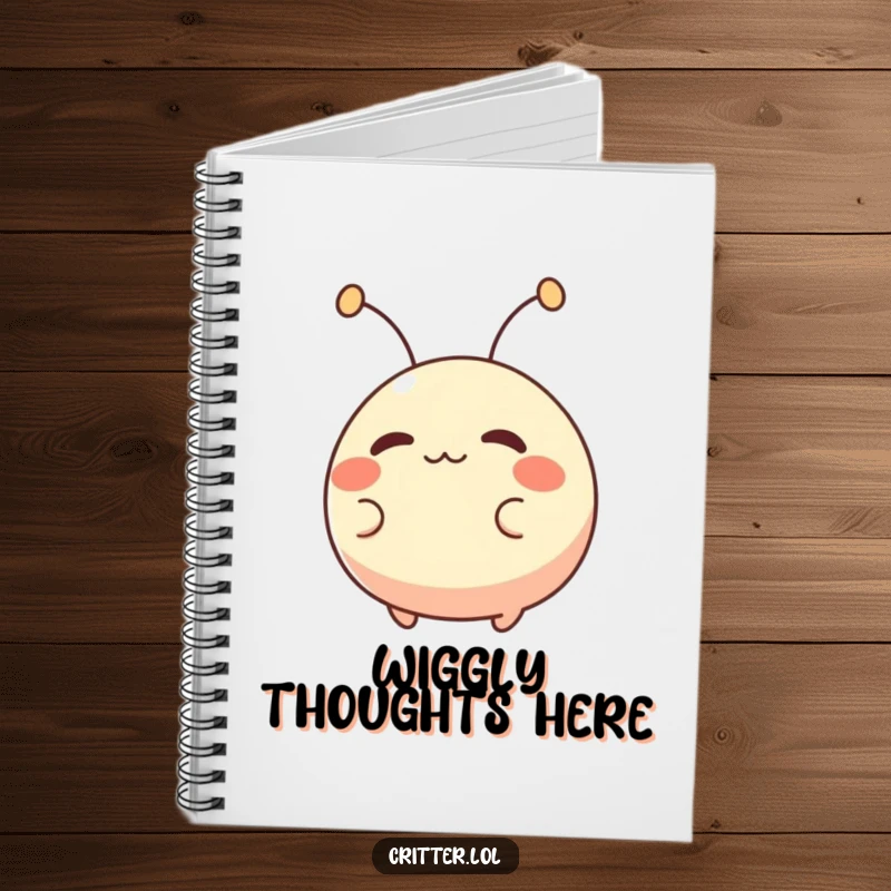 Funny notebook featuring a small, round creature with antennae wiggling excitedly, great for writing and capturing energetic thoughts.