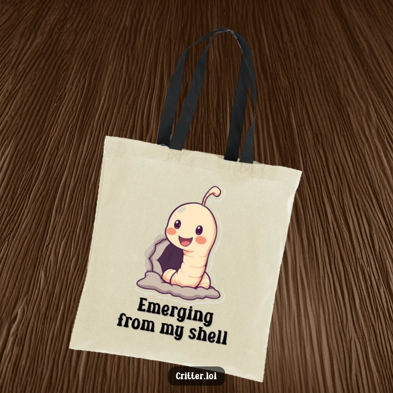 Funny tote bag with a smiling worm character peeking out of a hole, perfect for carrying items with a humorous touch.